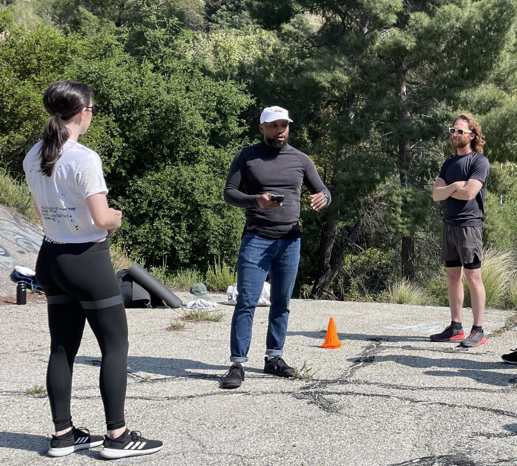 Isaiah directing a group of performers on a hillside